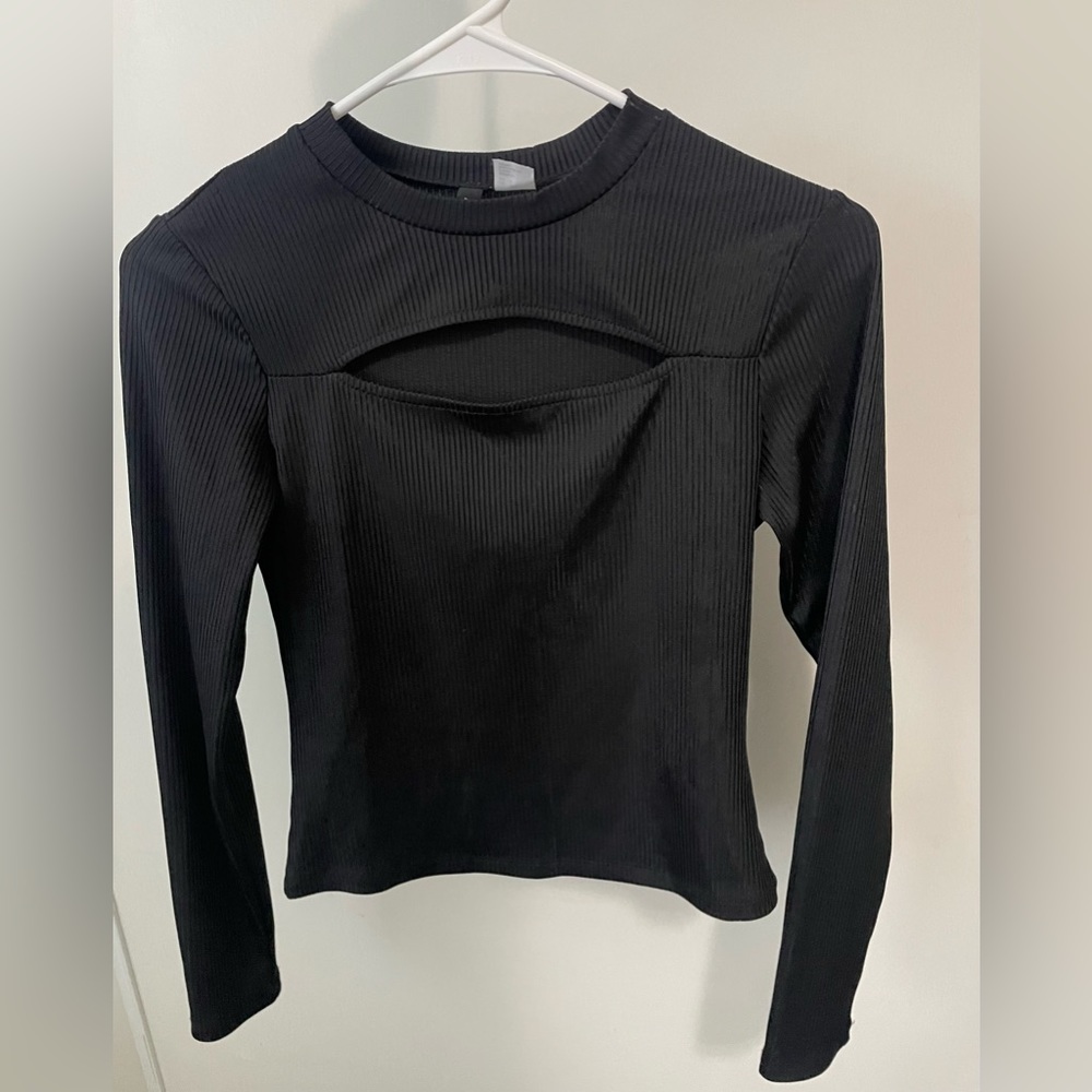 Black long sleeve top with cutout in the middle
